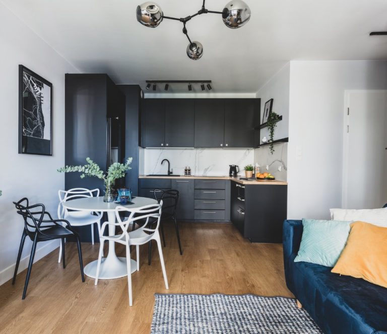 Kitchen with cupboards, coffee table, chairs and a couch. Perry Bishop estate agents